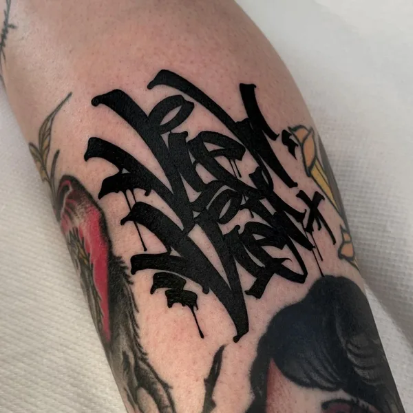 Calligraphy tattoo by Dustin | DESUR in Hamburg