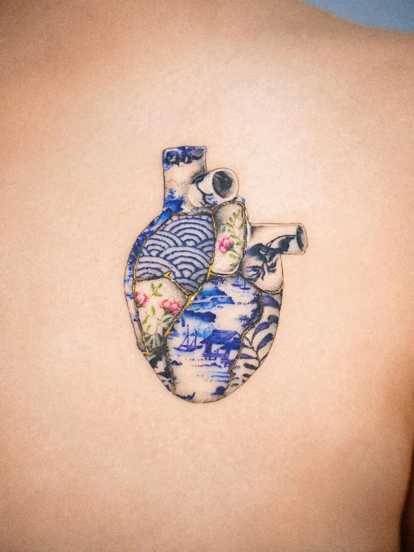 female color miniature Tatuaggio su upper back #43546 | Tatuatore E.nal