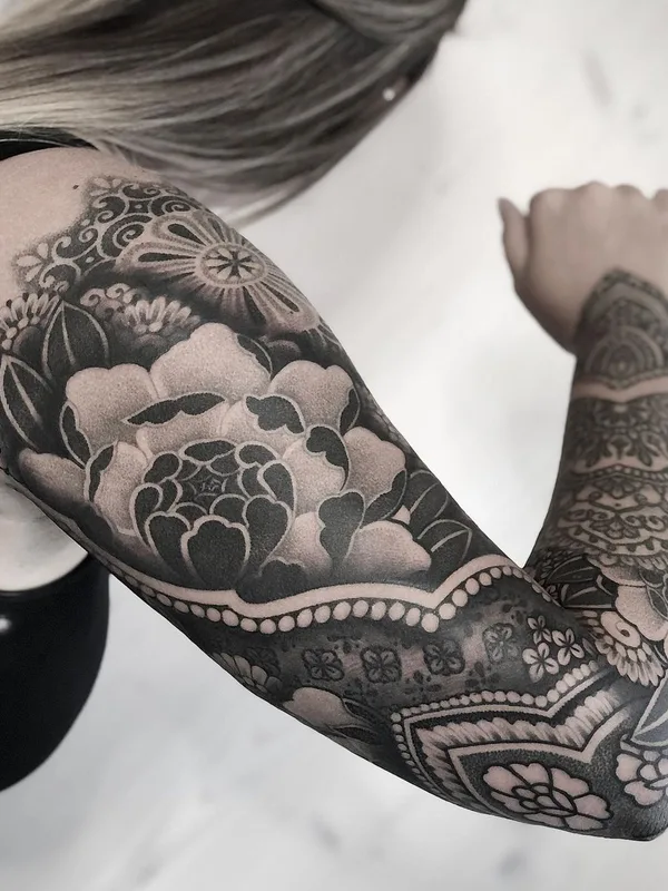 female black and grey blackwork tattoo on full sleeve #43553 | Tattoo Artist Mona Wanner