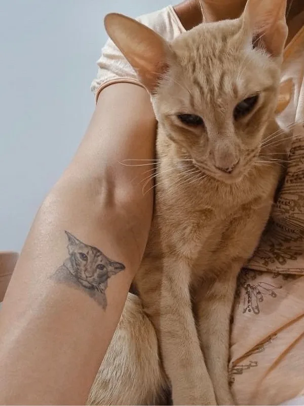 female black&gray animal, microrealism, pet tattoo on forehand #63850 | Tattoo Artist Анна Селезнева