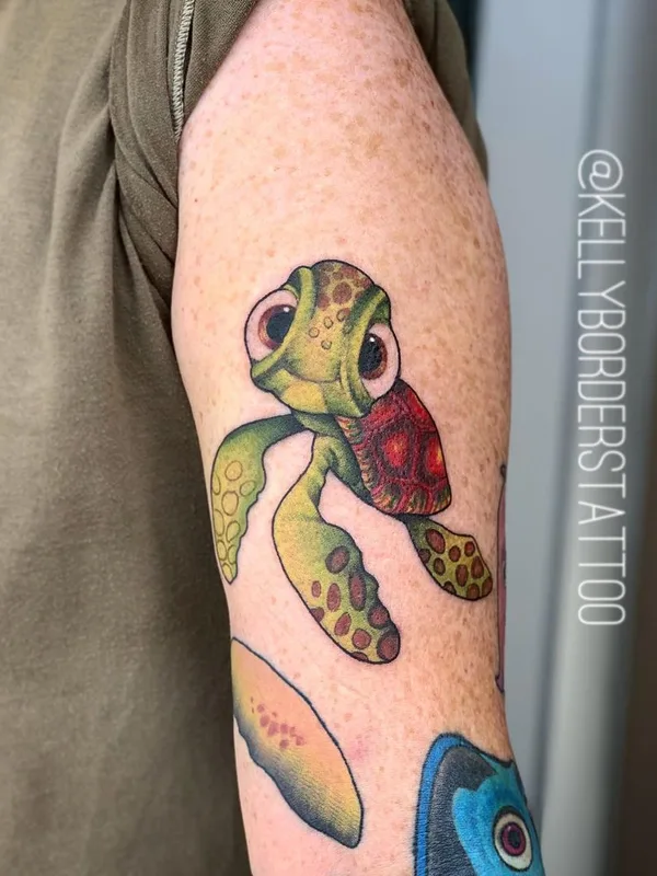 color cartoon tatuaje en forearm #40451 | Tatuador Kelly Borders