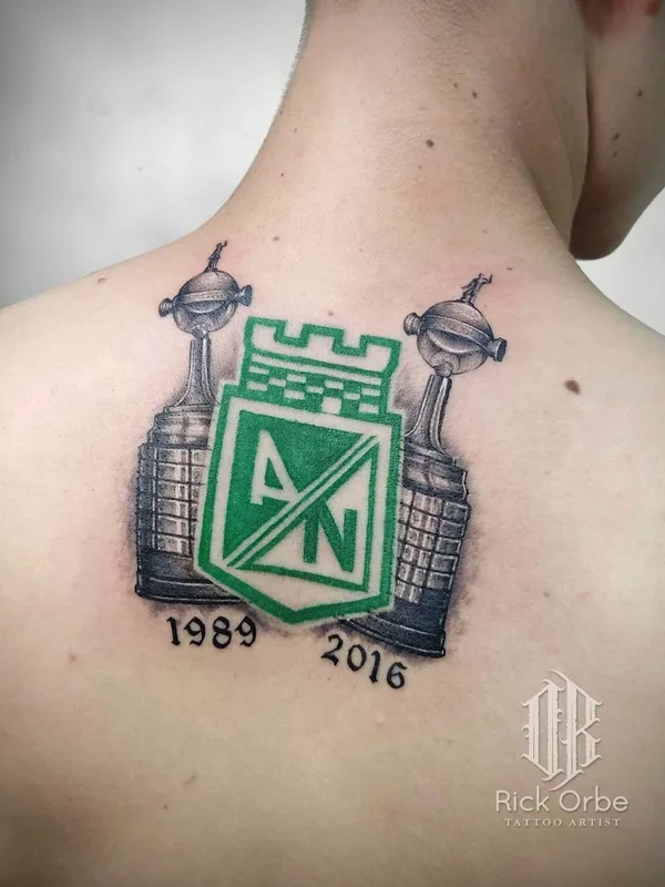 color black and grey tattoo on upper back #58679 | Tattoo Artist Rick Orbe
