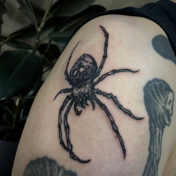 Graphic tattoo by George Pronin in Tbilisi