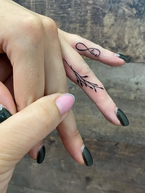 female black fineline tattoo on finger #49532 | Tattoo Artist Алёна Грицаенко
