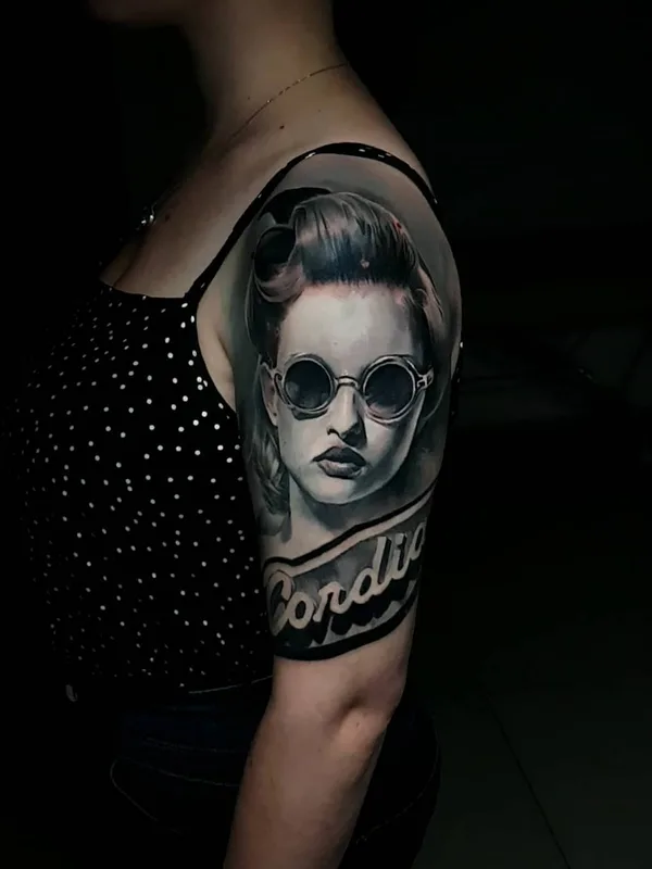 female black and grey realism tattoo on upper arm #59413 | Tattoo Artist Dan Starr
