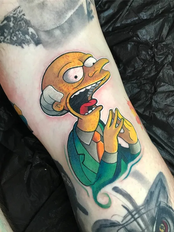 color cartoon tattoo on calf #24791 | Tattoo Artist Brent Goudie