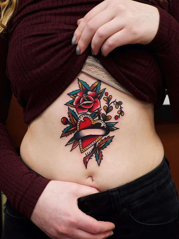 female color traditional tattoo auf stomach #21945 | Tätowierer Electric Martina