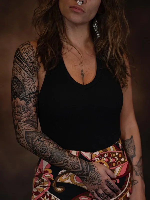 female black and grey ornamental tattoo on full sleeve #76209 | Tattoo Artist Dino De Cesare