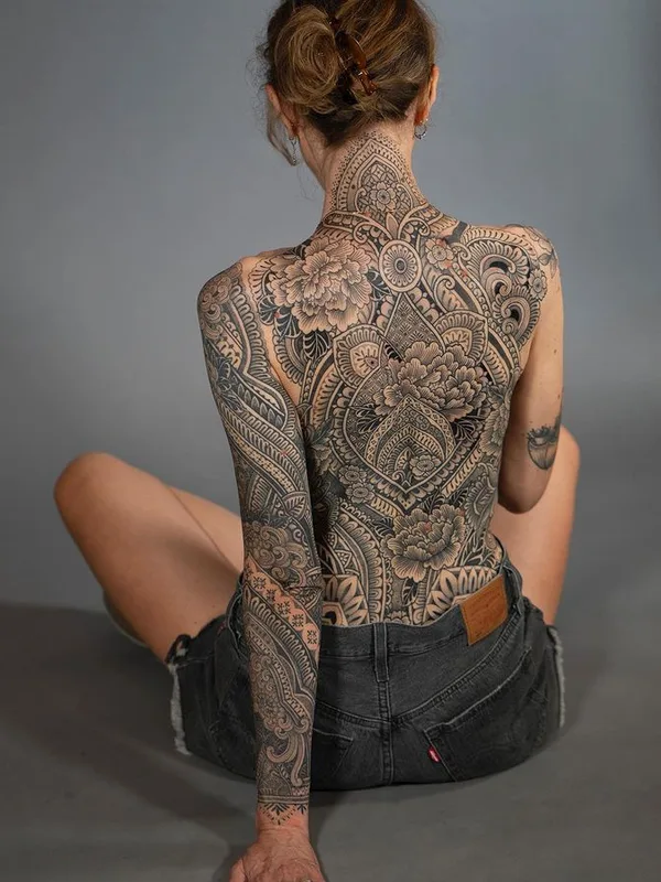 female black and grey ornamental tattoo on full back #76213 | Tattoo Artist Dino De Cesare
