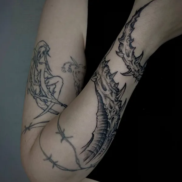 Graphic tattoo by George Pronin in Tbilisi