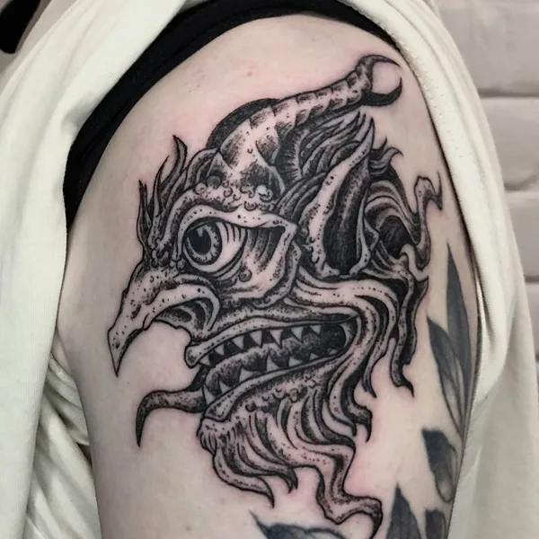 Graphic tattoo by George Pronin in Tbilisi