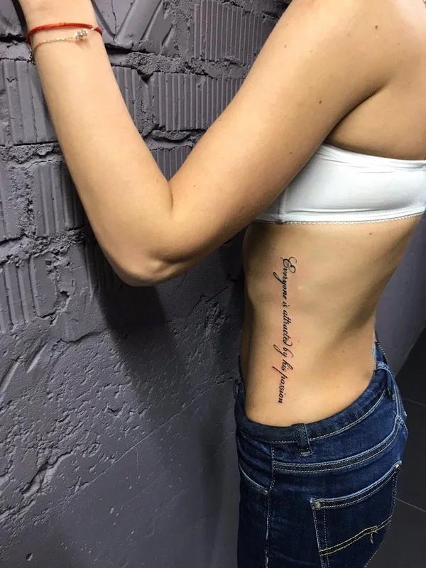 female black lettering татуировка на ribcage #27245 | Тату мастер Kseniia Brykalova