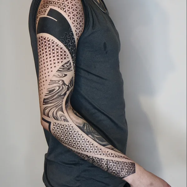 Geometric tattoo by Ivan Tahine  in Tbilisi
