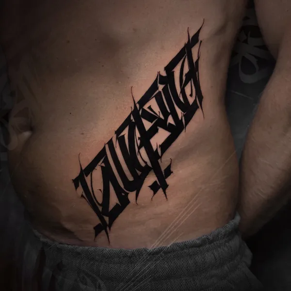 Lettering tattoo by Mayya Gri in Moscow