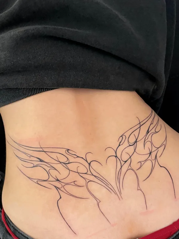 female black linework tattoo on lowerback #87124 | Tattoo Artist Ольга Глотова 