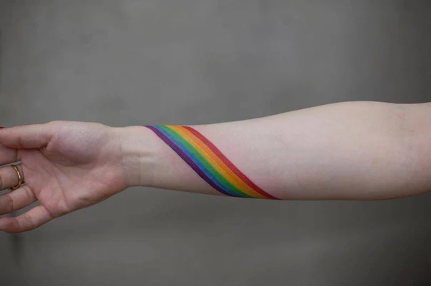 Watercolor Rainbow tattoo on Wrist