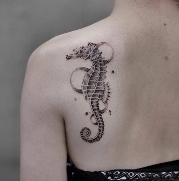 Black & Grey Seahorse tattoo on Shoulder Blade