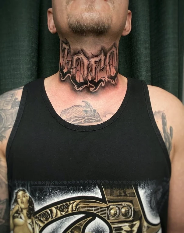 Chicano Lettering tattoo on Neck