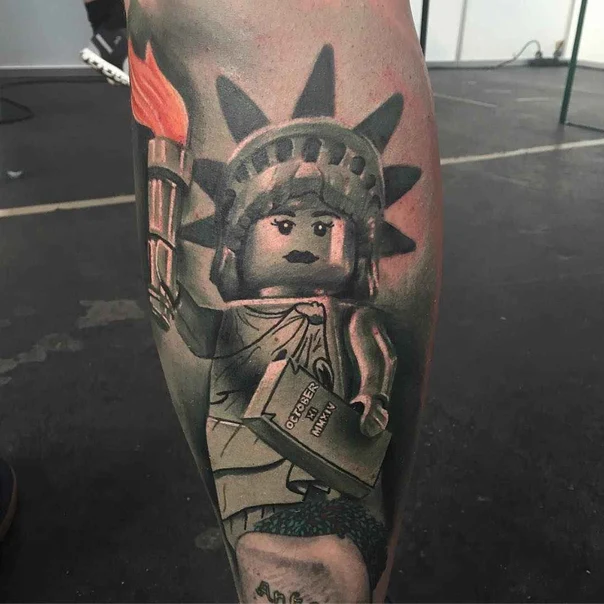 Black & Grey Statue of liberty, Lego tattoo on Calf