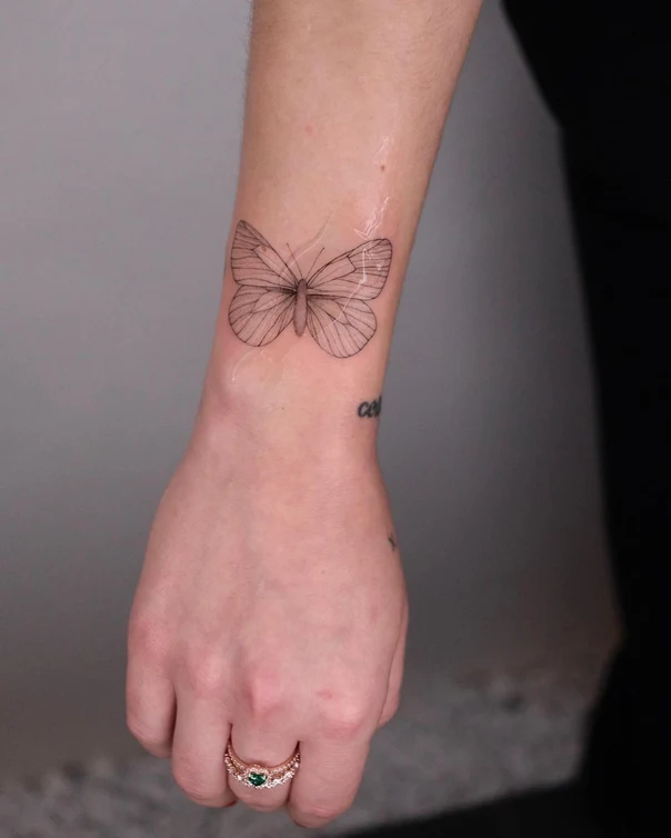 Linework Butterfly tattoo on Wrist