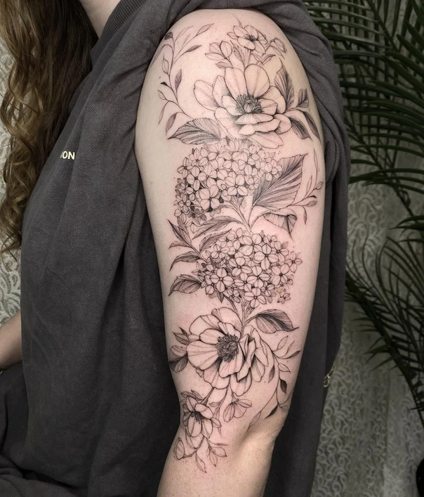 Botanic Flowers, Leaves tattoo on Upper Arm
