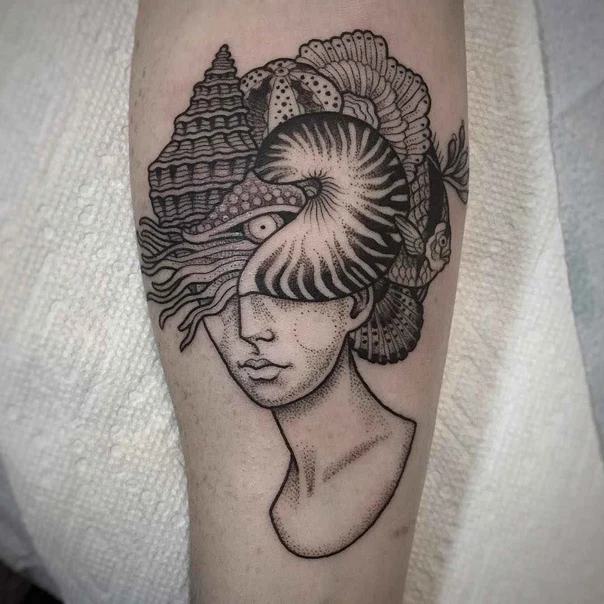 Illustrative Sea shell, Fish tattoo on Forearm