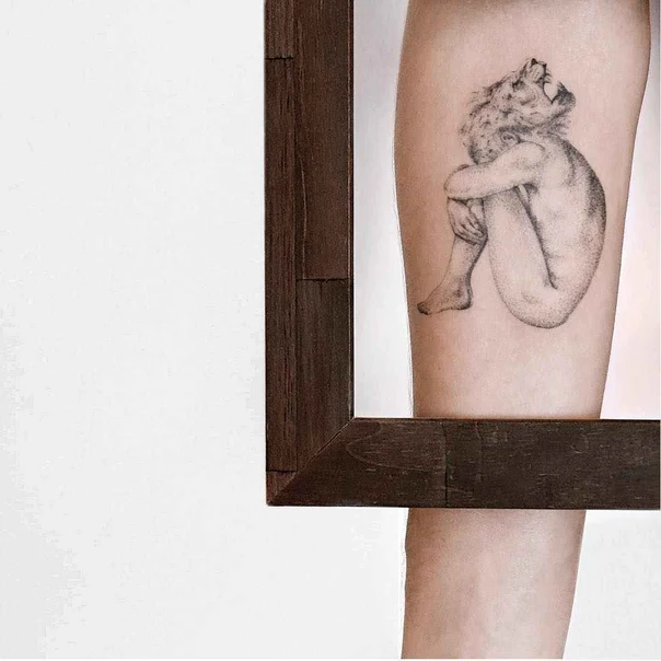 Black & Grey Figure tattoo on Thigh