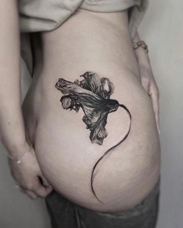 Blackwork Flower tattoo on Hip