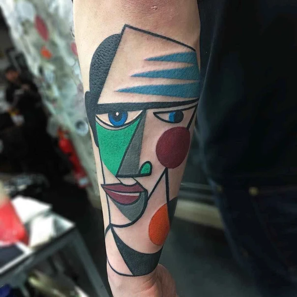 Abstract Face tattoo on Forearm