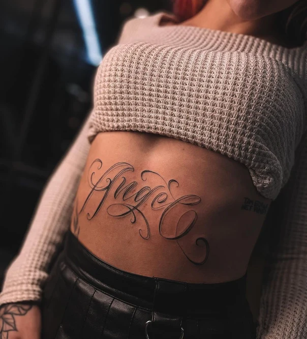 Lettering Text tattoo on Stomach