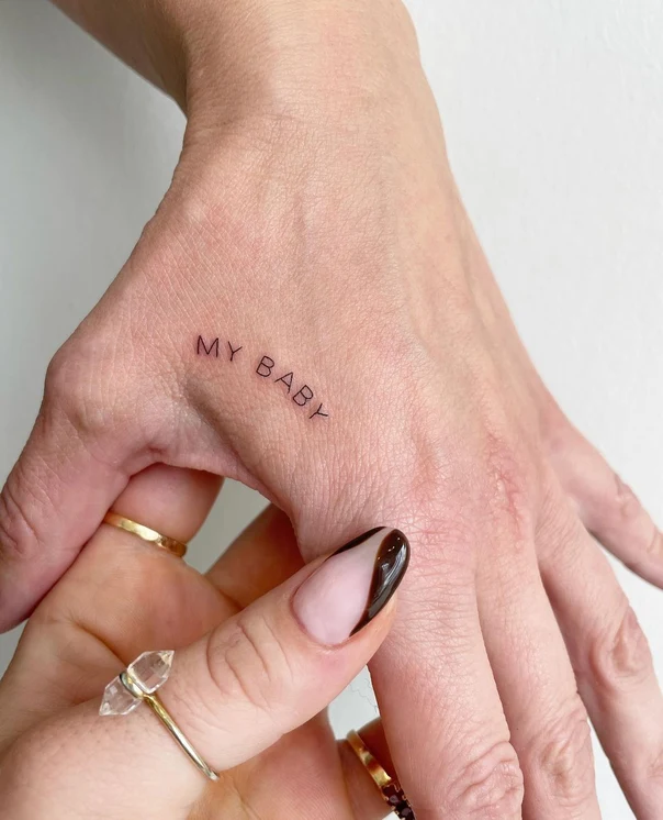 Fineline Text tattoo on Back of Hand