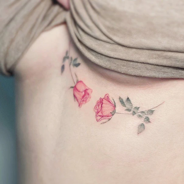 Fineline Rose tattoo on Ribcage