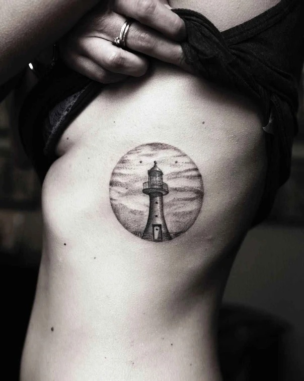 Black & Grey Lighthouse, Sky tattoo on Ribcage