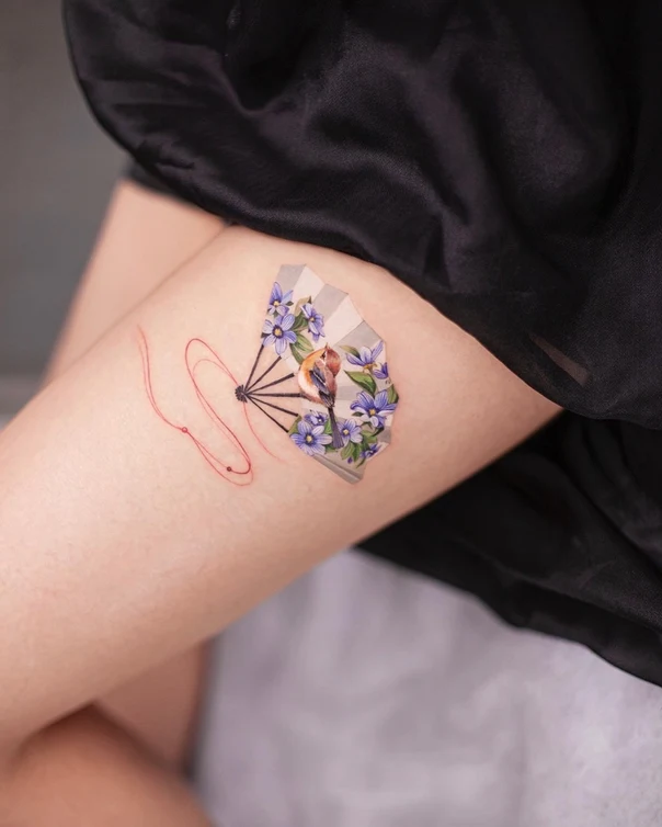 Illustrative Fan, Bird tattoo on Thigh