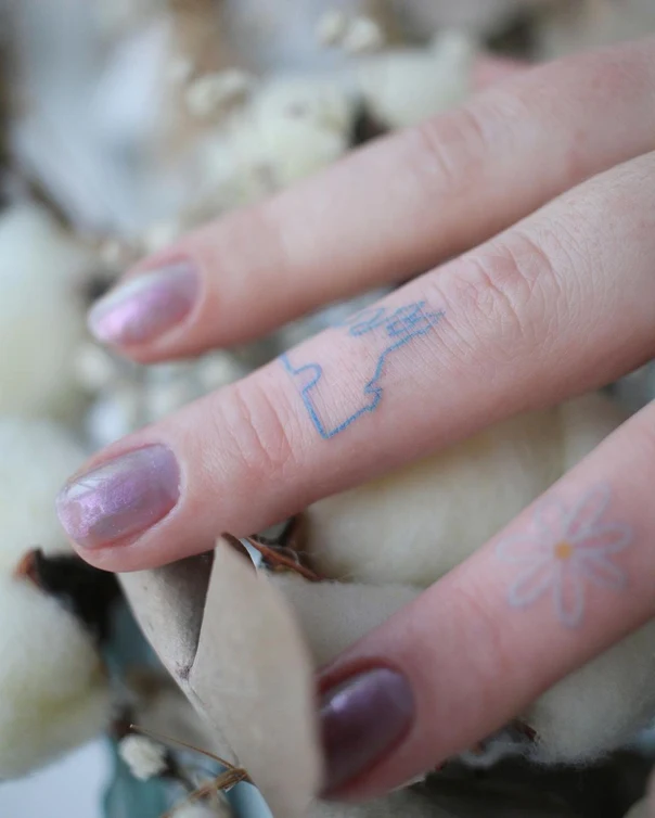 Fineline Geometric, Flower tattoo on Finger