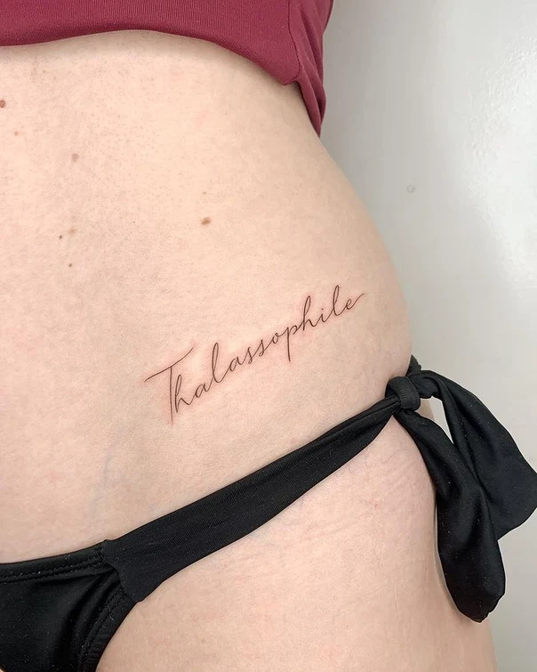Fineline Text tattoo on Hip