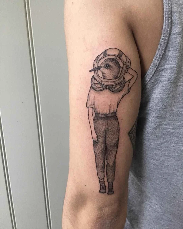 Blackwork Bird, Astronaut tattoo on Upper Arm