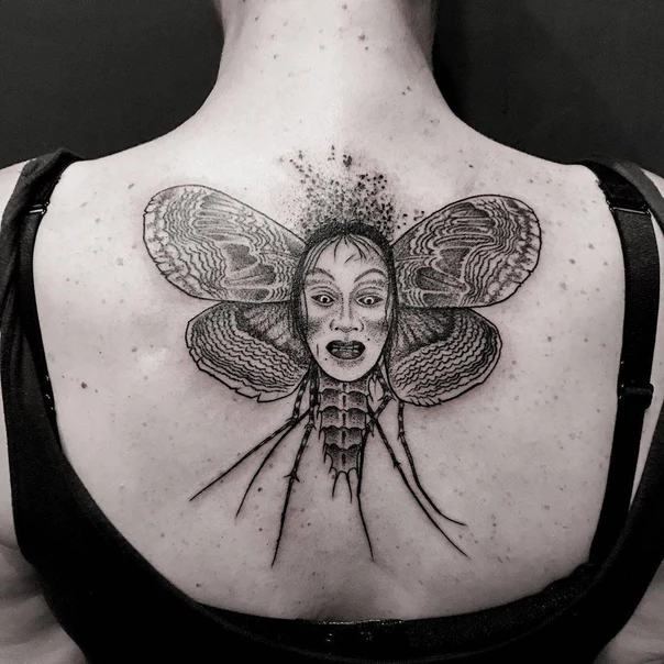Blackwork Face, Moth tattoo on Upper Back