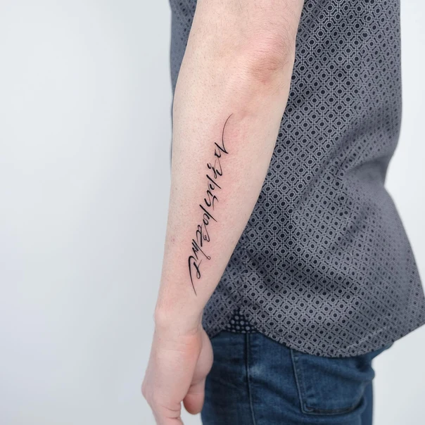 Calligraphy Lettering tattoo on Forearm