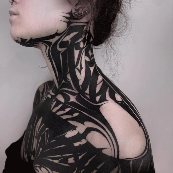 Blackwork tattoo on Neck