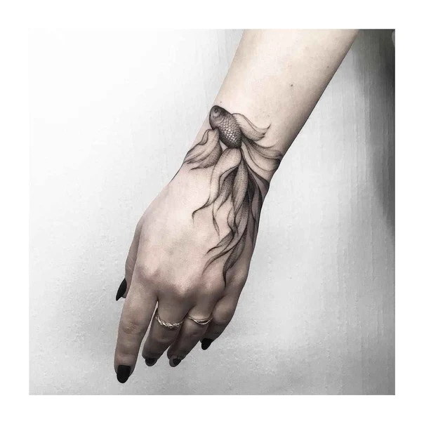 Black & Grey Fish tattoo on Back of Hand