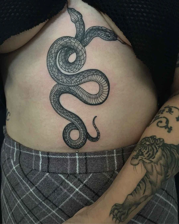 Blackwork Snake tattoo on Stomach