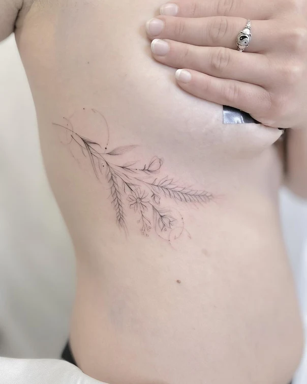Fineline Flowers, Leaves tattoo on Ribcage