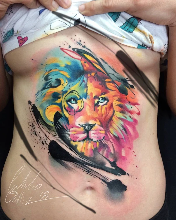 Watercolor Lion tattoo on Sternum