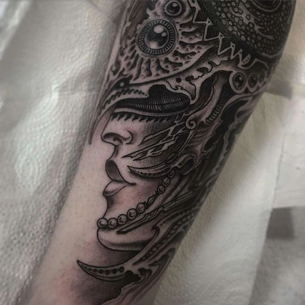 Biomechanical Face, Abstract tattoo on Forearm