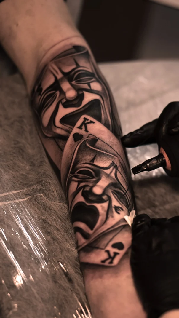 Black & Grey Masks, Playing cards tattoo on Forearm