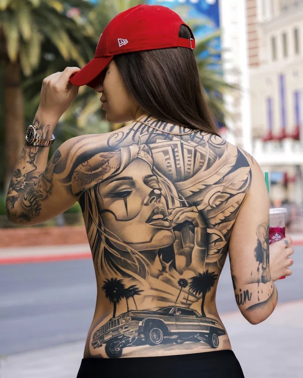 Chicano Woman, Money tattoo on Full Back