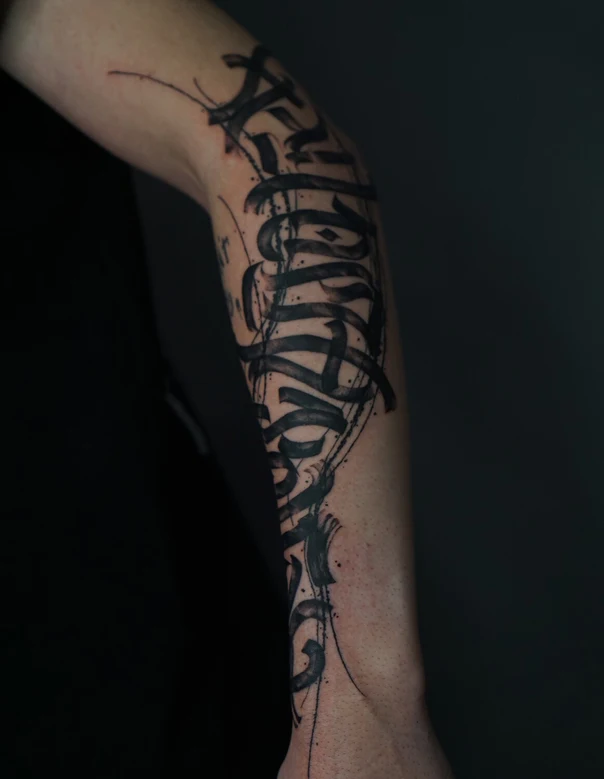 Calligraphy Lettering tattoo on Forearm