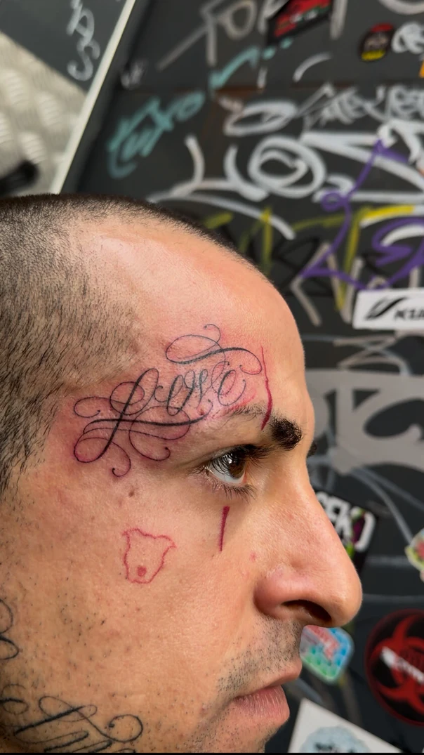 Calligraphy Word tattoo on Face