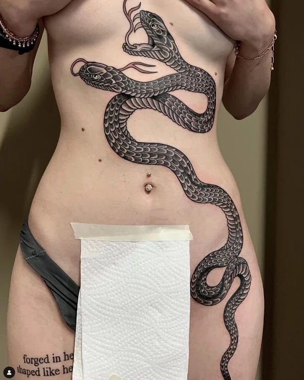 Blackwork Snake tattoo on Stomach